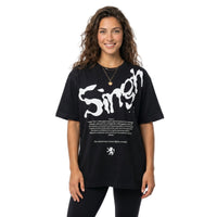 Person wearing a black t-shirt with white text and graphics on a white background